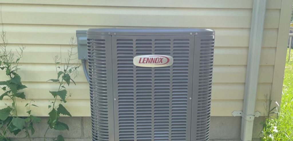 Closeup of Lennox AC unit outside home.