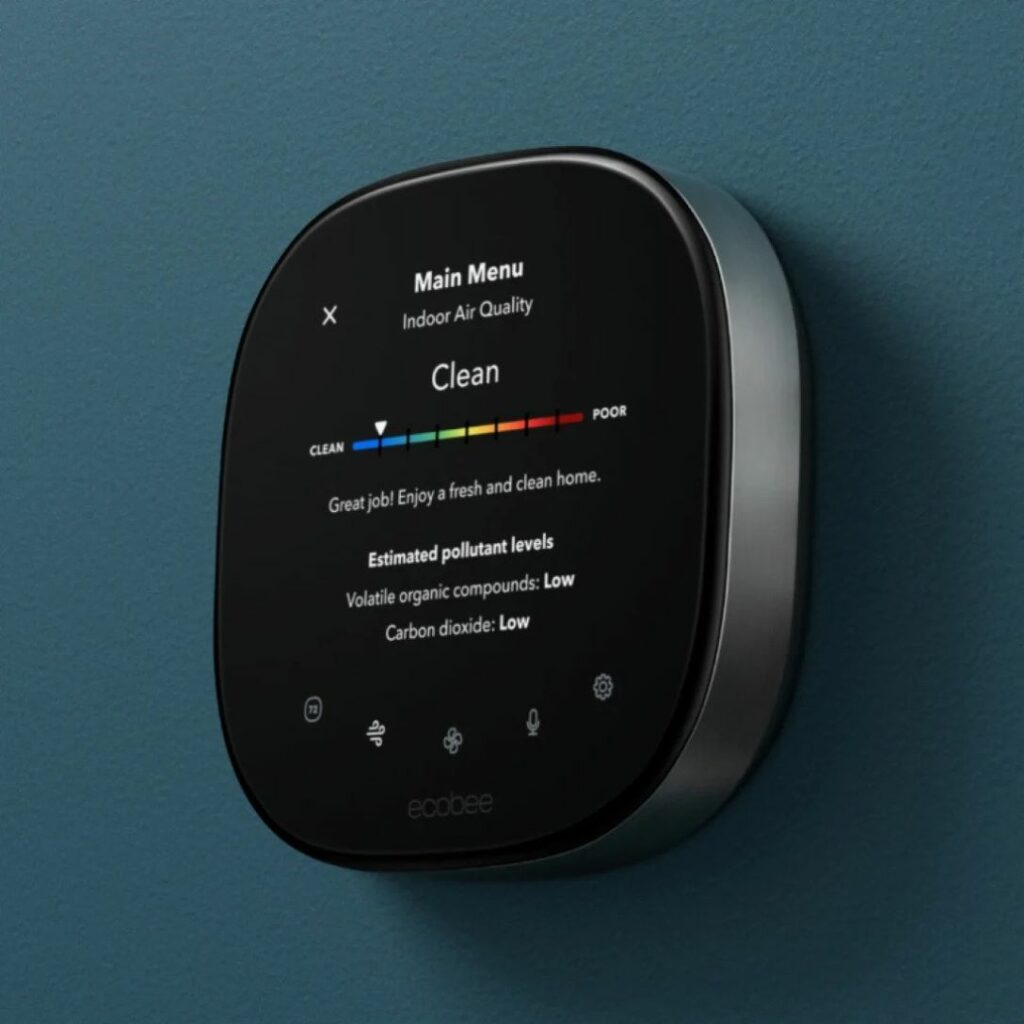 Smart thermostat showing clean air quality inside home.